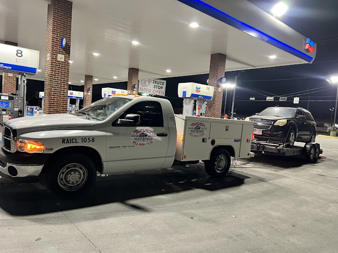 A truck is parked in front of a gas station